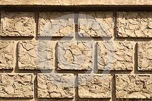 Old brick wall background. wall from squared bricks