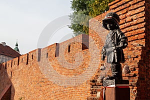 Old brick wall behind Maly Powstaniec statue in commemoration of the child soldiers
