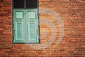 Old brick Wall with blue Window,Vintage style background