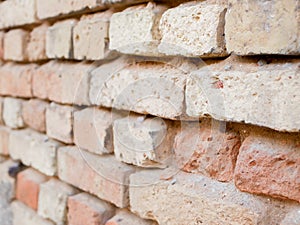 Old brick wall closeup side view. Background of bricks. Background texture