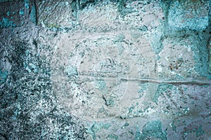 old brick wall. cracked concrete. Green tide, blue texture. vintage background. rustic style, mold.