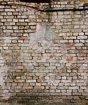 Old brick wall with cracks