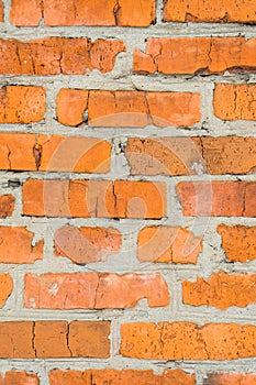 Old brick wall with cracks. Wall of red brick.