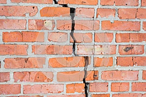 Old brick wall with cracks. Wall of red brick.