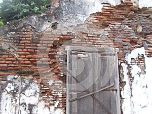 Old brick wall damage and dirty and old window