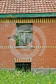 old brick wall of a decaying building photo