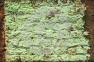 Old brick wall with dirty peeling paint. Close-up texture, vintage background