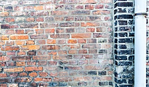 Old brick wall with downpipe