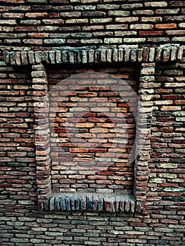 Old brick wall with lots of texture and colors.