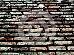 Old brick wall with lots of texture and colors.