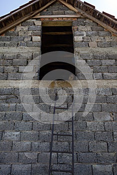 Old Brick Wall and Metal Ladders