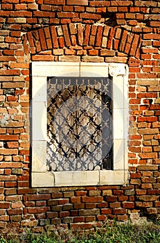 On the old brick wall is a mysterious window