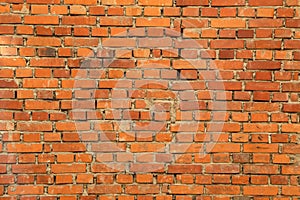 Old brick wall, old texture of red stone blocks closeup