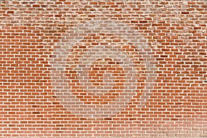 Old brick wall, old texture of red stone blocks closeup