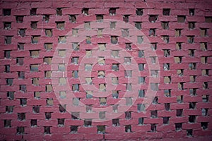 Old brick wall, old texture of red stone blocks with wholes closeup