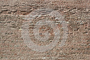 Old brick wall with the pattern for the archs