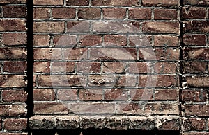 Old brick wall for texture or background, dark color, architectural elements as a brick filled frame