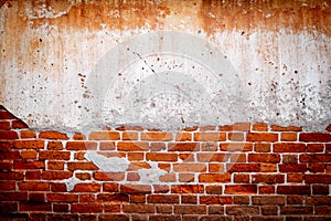 Old brick wall texture with Damaged Plaster ,Grunge Red Stonewall Background  , grunge background and copy space