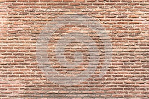 Old brick wall, old texture of red stone blocks closeup