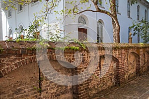 Old Brick Wall and White Historic Building Charleston SC