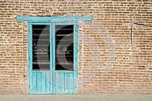 Old brick wall with window