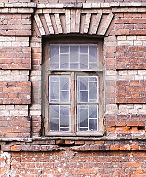 Old brick wall with a window. architecture, details.