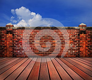 Old brick wall wood terrace with blue sky backgrund