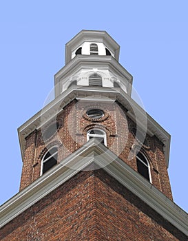 Old brick and wood tiered tower.