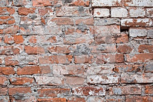 Old brick wrecked wall biege grunge surface weathered concrete cement with holes, erosion and destruction. Texture, background