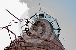 Old bricks factory chimney with bricks. blue sky background