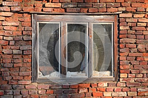 Old bricks wall with window