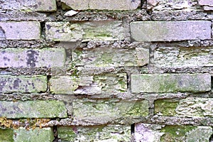 Old brickwork. Brick wall. White silicate brick. Crumbling brick from time to time