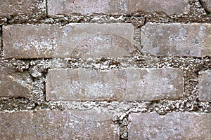 Old brickwork. Brick wall. White silicate brick. Crumbling brick from time to time