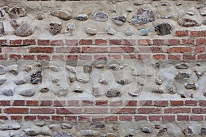 Old bricky wall with stones