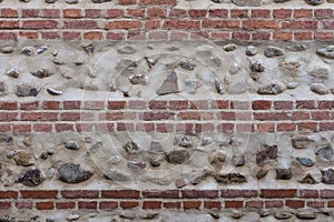 Old bricky wall with stones