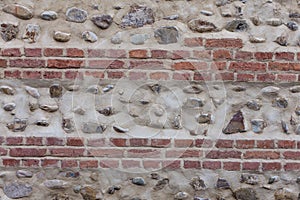 Old bricky wall with stones