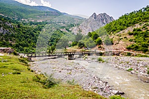 Old bridge above Black Drin river near village Malqene in Albania photo
