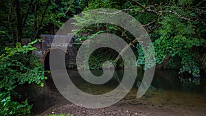 Old bridge across the Frame river in a small town in Dorset, UK