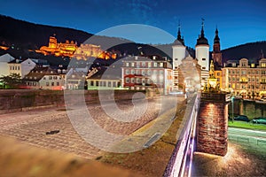 Old Bridge (Alte Brucke) at night with Bruckentor (Bridge Gate) and Heidelberg Castle - Heidelberg, Germany