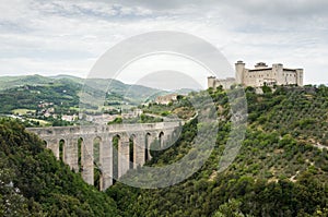 The old bridge aqueduct Ponte delle Torri and the medieval fortress Rocca Albornoziana. Spoleto, Umbria, Italy.