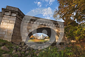 Old bridge on the background  An ancient palace and park in the city of Gatchina.