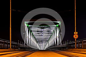 The old bridge in Bratislava is lit at night