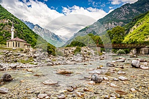 Old bridge in Dragobi over river Lumi i Valbones National Park Valbona in Albania, Europe