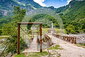 Old bridge in Dragobi over river Lumi i Valbones National Park Valbona in Albania, Europe