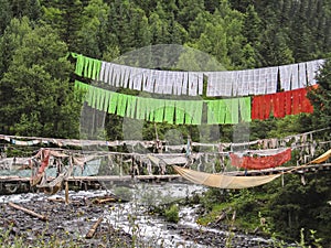 old bridge and flags of a Tibet