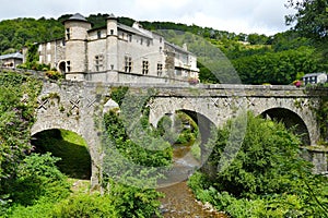 The old bridge in front of the castle in the village of Lacaze photo