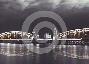 Old bridge. Neva riverscape with Smolny cathedral and Bolsheohtinskiy bridge at night. St.Petersburg, Russia