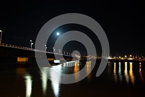 old bridge at night with light