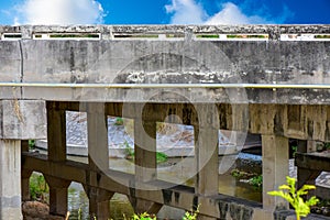 Old bridge over the Canal to factory. Reinforced concrete bridge for trucks running through the factory