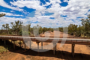Old bridge over a dried out river in drought